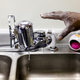 A handyman at the Shiloh Commons in Flint, Mich., installs a new water filter in a residence Jan. 21, 2016.
Sarah Rice/Getty Images